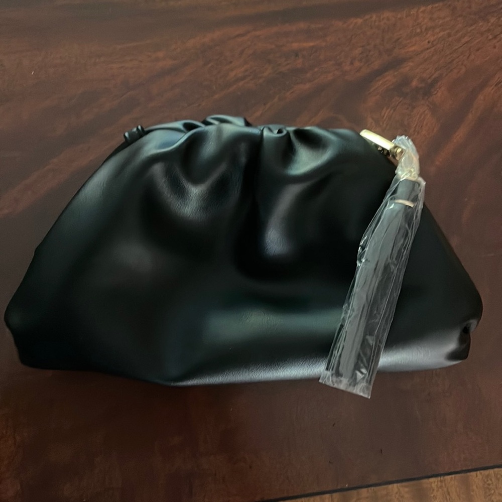 Vegan leather black clutch by Understated Leather with removable shoulder strap